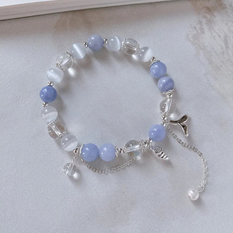 Close-up of the clasp and charm details on the Pearl Beaded Bracelets