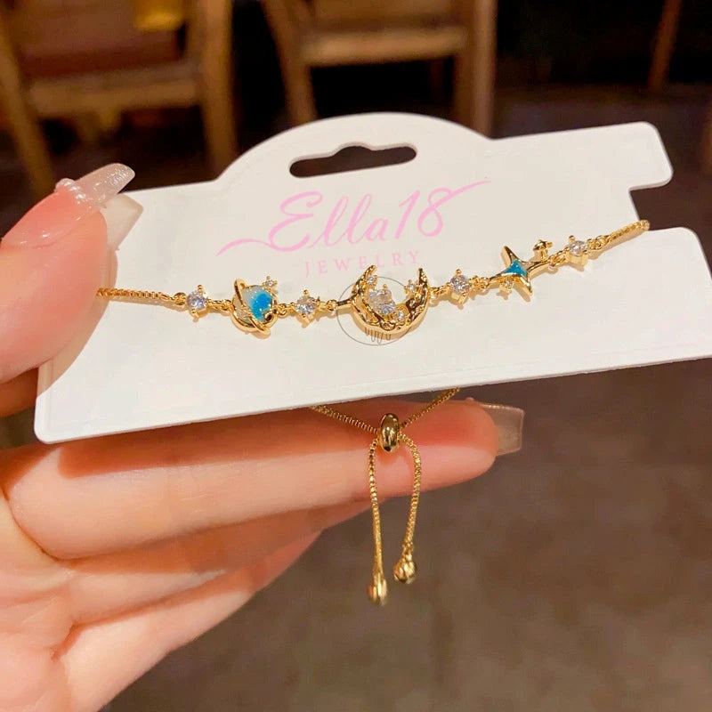 Close-up of the clasp and charm details on the Star And Moon Bracelet