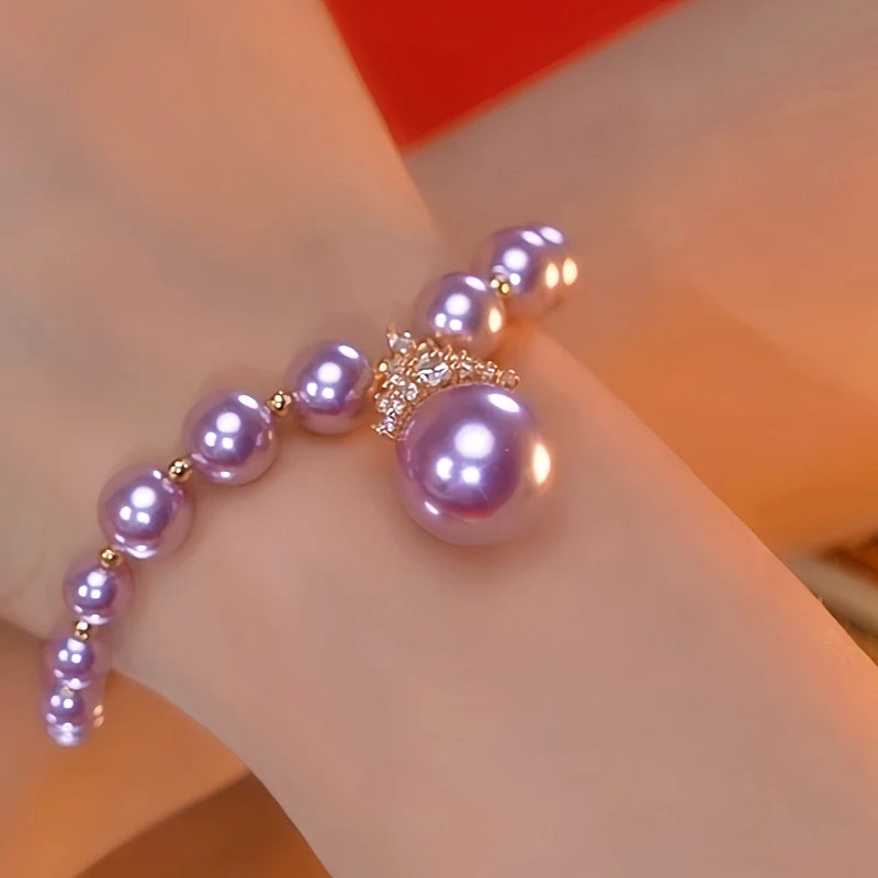 Close-up of the clasp and charm details on the Purple Pearl Bracelet