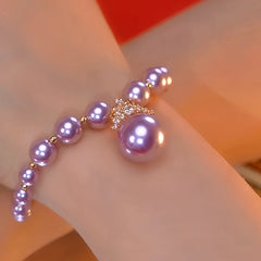 Close-up of the clasp and charm details on the Purple Pearl Bracelet