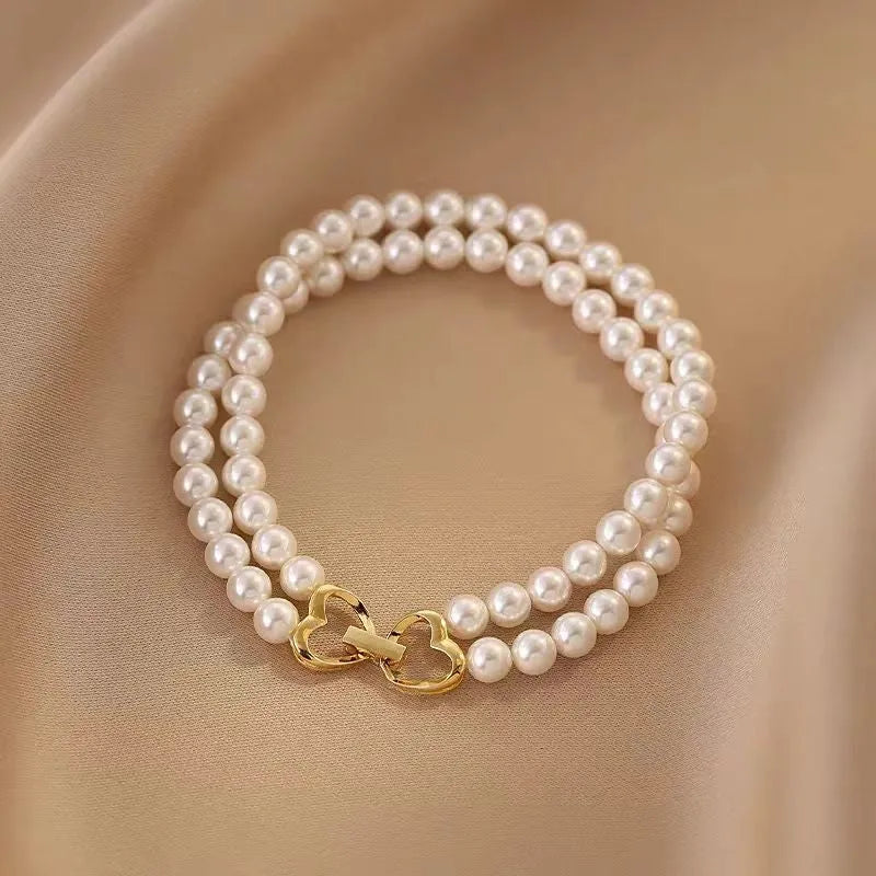 Full view of the elegant 14K Gold-plated Exquisite Heart-Design Double-Layer Pearl Bracelets