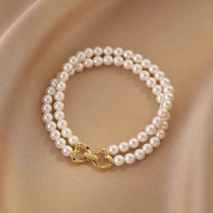 Full view of the elegant 14K Gold-plated Exquisite Heart-Design Double-Layer Pearl Bracelets