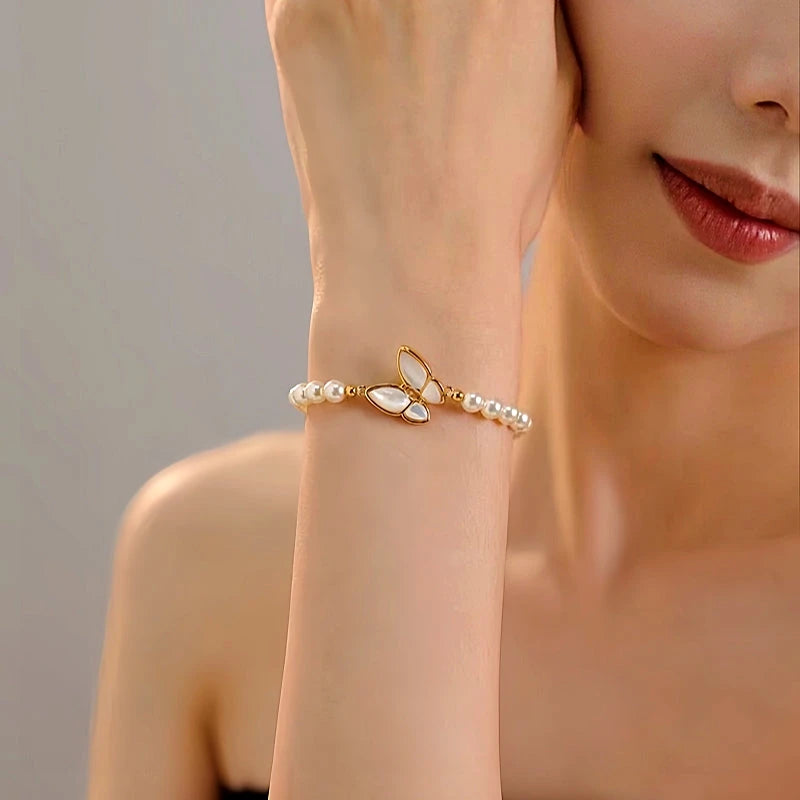 Close-up of the clasp and charm details on the Pearl Butterfly Bracelets