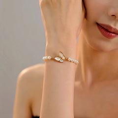 Close-up of the clasp and charm details on the Pearl Butterfly Bracelets