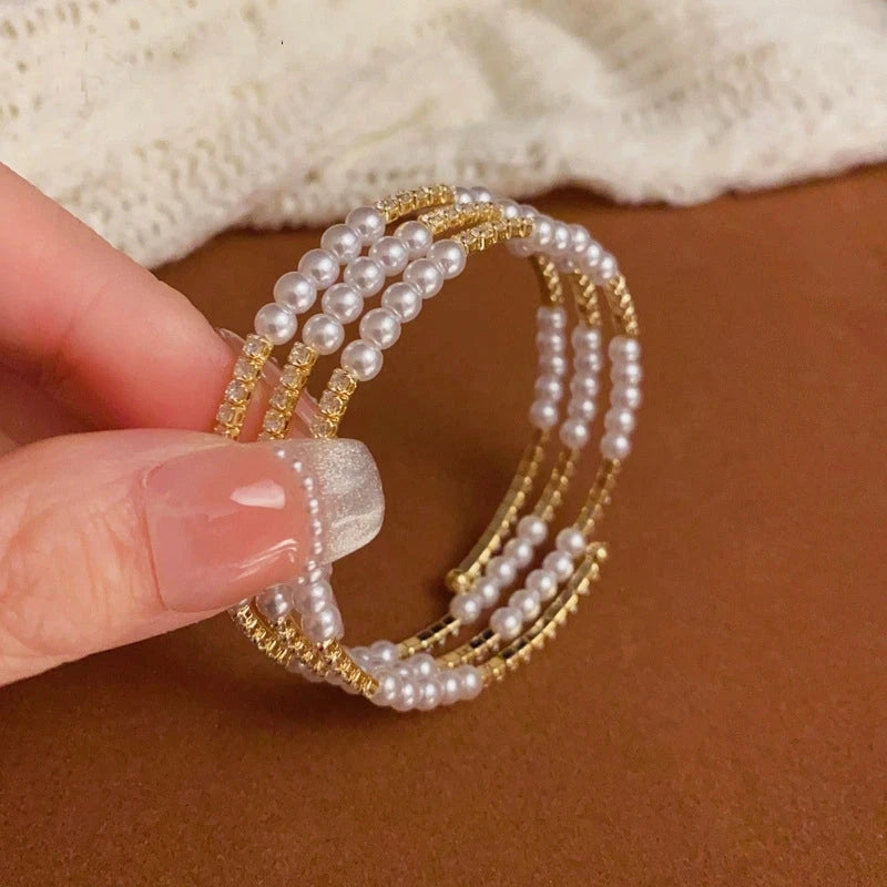 Close-up of the clasp and charm details on the Pearl Stacking Bracelets