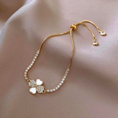 Model wearing the 14K Gold-plated Exquisite Zircon Adjustable Four-Leaf Bracelets to highlight its design on the wrist