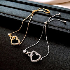 Close-up of the clasp and charm details on the Adjustable Heart Bracelet