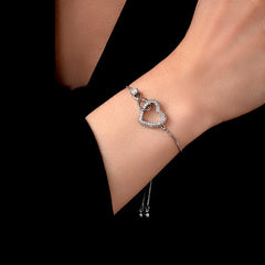 Model wearing the 14K Gold-plated Exquisite Zircon Adjustable Heart Bracelet to highlight its design on the wrist