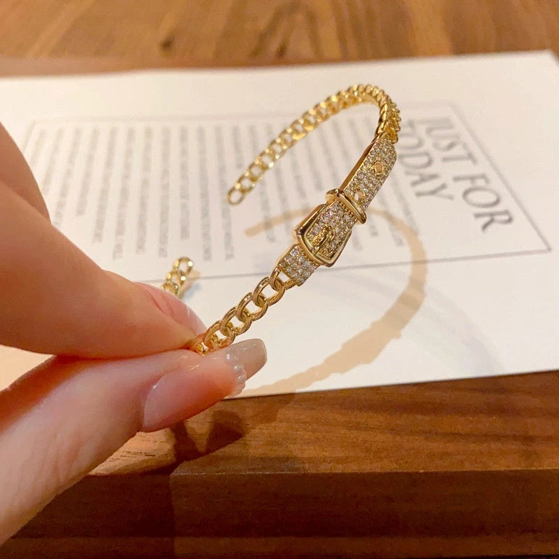 Close-up of the clasp and charm details on the Belt Buckle Bracelets