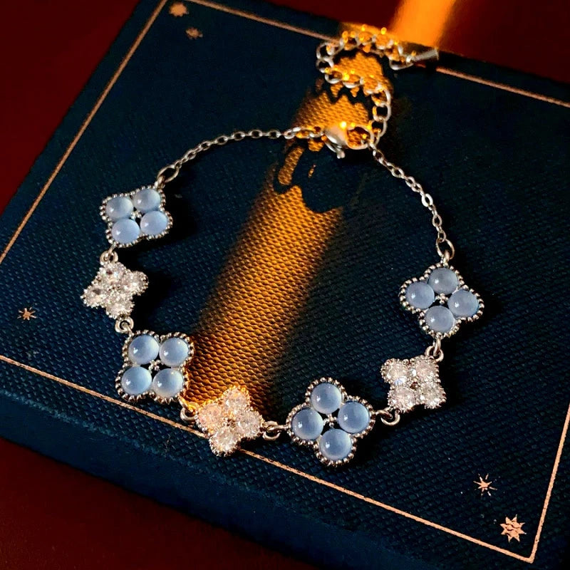 Close-up of the clasp and charm details on the Cat's Eye Four-Leaf Bracelets