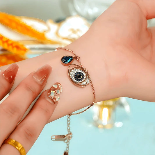 Model wearing the 14K Gold-plated Exquisite Zircon Dream Blue Angel Eye Bracelet to highlight its design on the wrist