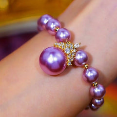 Close-up of the clasp and charm details on the Purple Pearl Bracelet