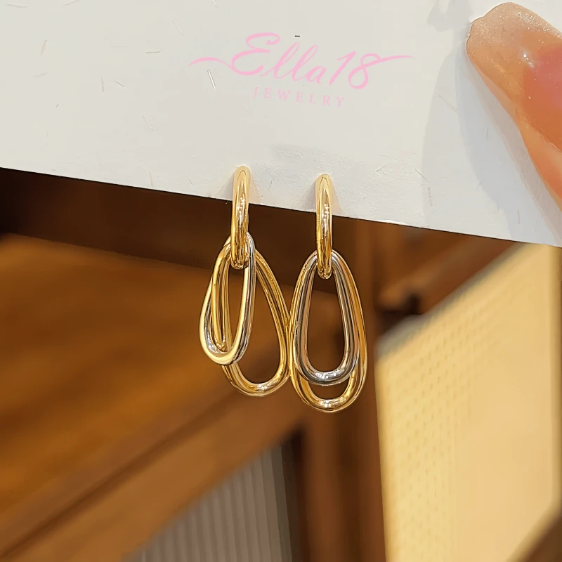 Angled view of the 14K Gold-plated Geometric Pendant Earrings
