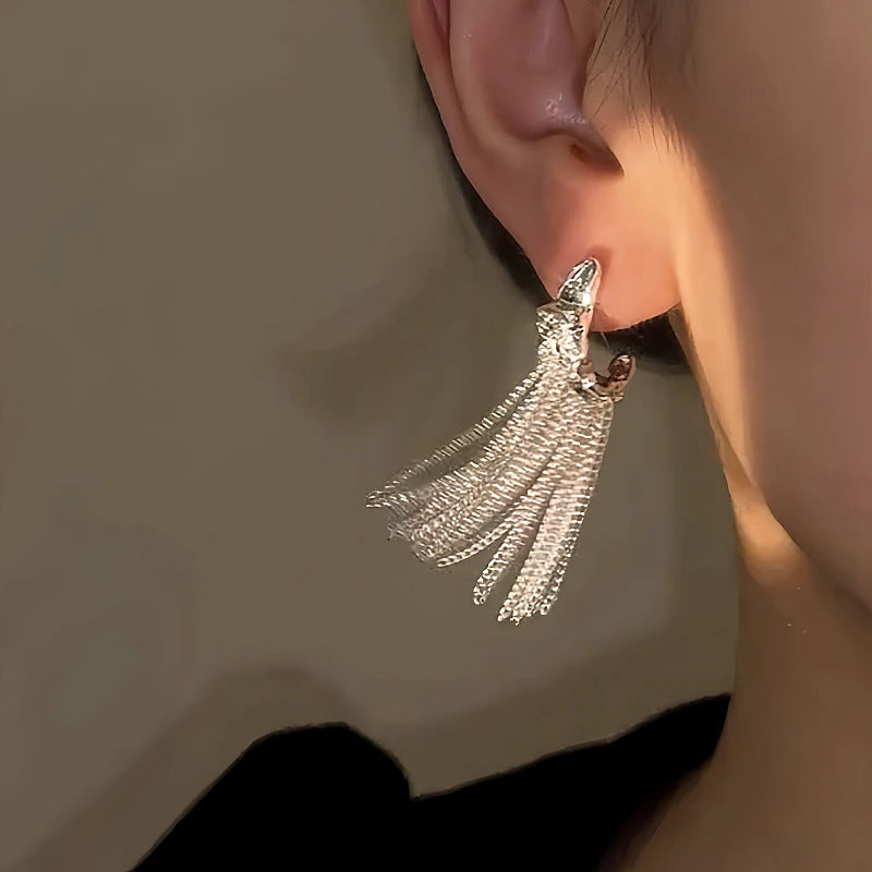 Close-up detail of the sparkling zircons and plating on the Geometric Tassel Earrings