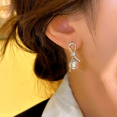 Close-up detail of the sparkling zircons and plating on the Knotted Tassel Earrings