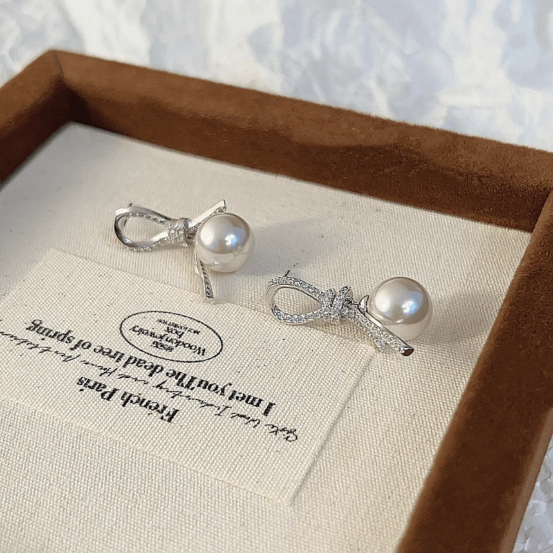 Angled view of the 14K Gold-plated Knotted Bead Tassel Earrings