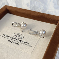 Angled view of the 14K Gold-plated Knotted Bead Tassel Earrings