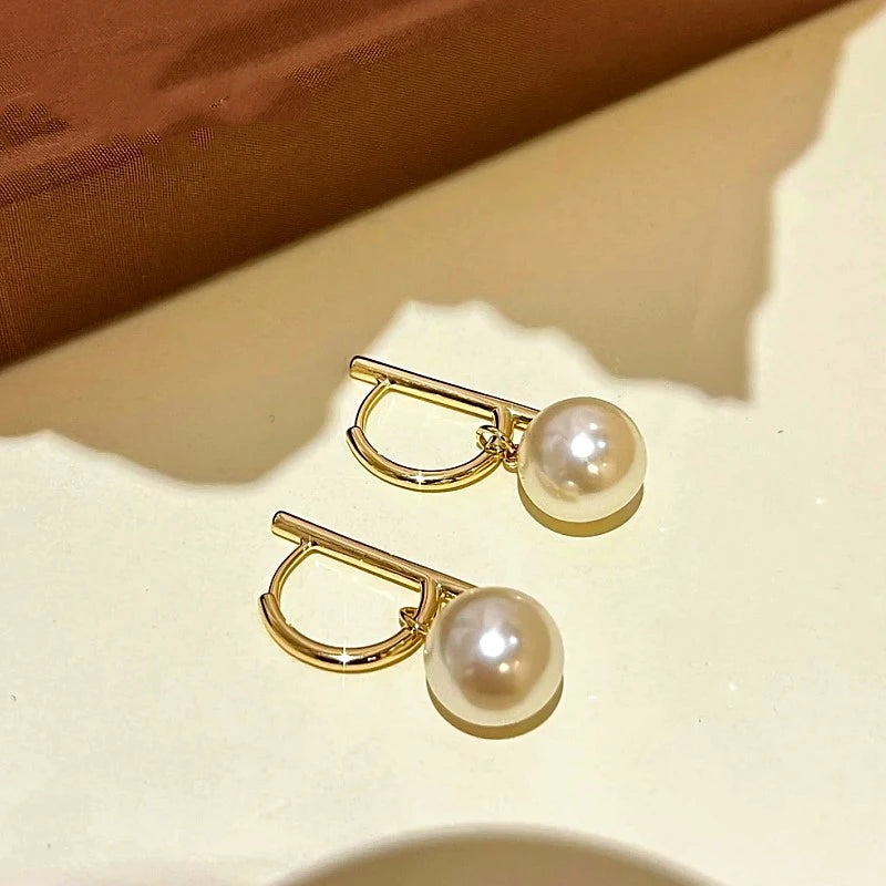 Close-up detail of the sparkling zircons and plating on the D Monogram Drops