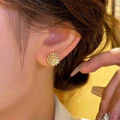 Model showcasing the dangle and style of the 14K Gold-plated Luxury Daisy Flower Stud Earrings