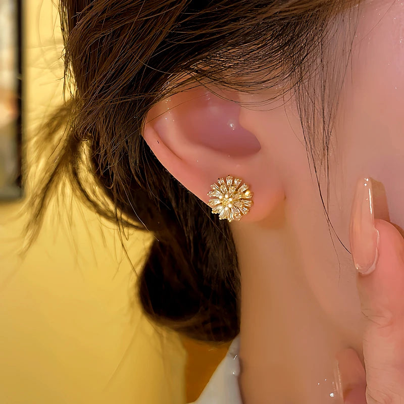 Close-up detail of the sparkling zircons and plating on the Daisy Flower Studs