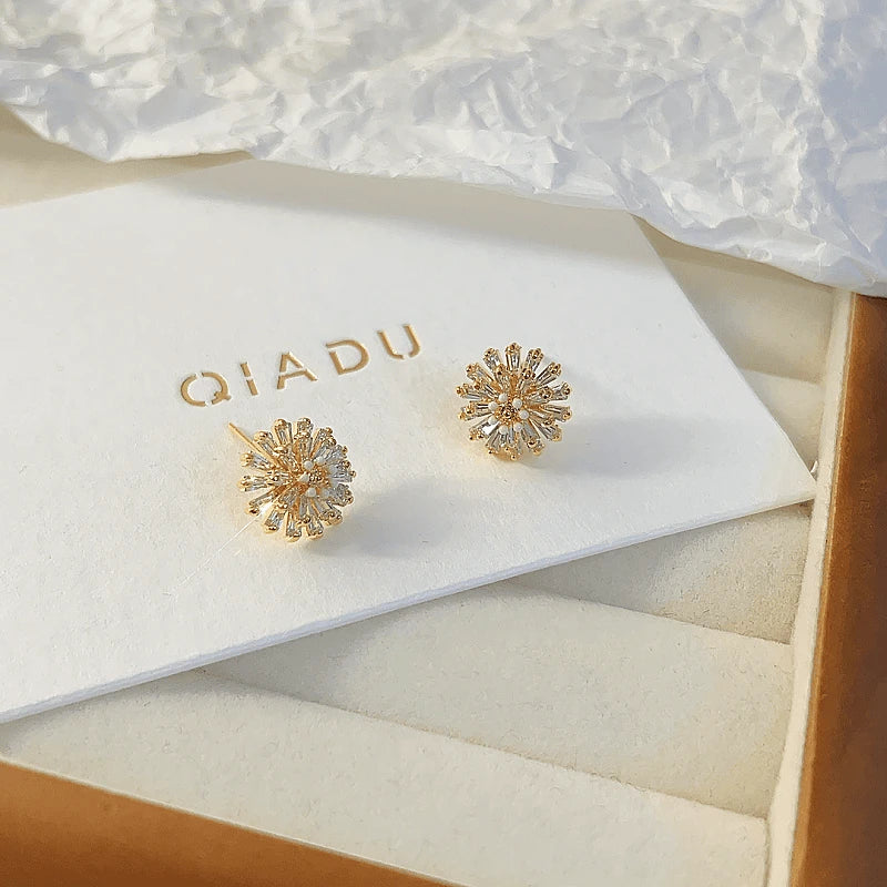 Angled view of the 14K Gold-plated Luxury Daisy Flower Stud Earrings