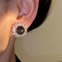 Close-up detail of the sparkling zircons and plating on the Grey Crystal Earrings