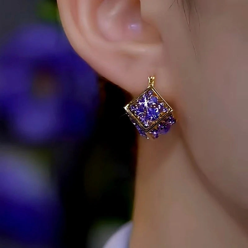 Close-up detail of the sparkling zircons and plating on the Purple Diamond Earrings