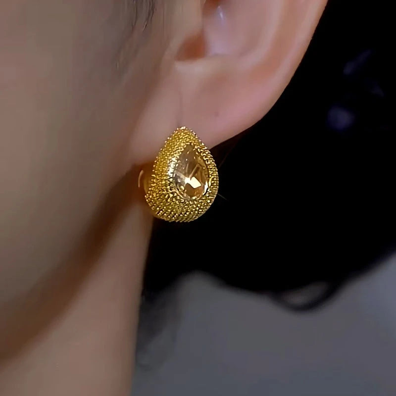 Close-up detail of the sparkling zircons and plating on the Yellow Diamond Earrings