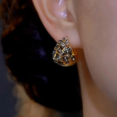 Model showcasing the dangle and style of the 14K Gold-plated Luxury Zircon Earrings