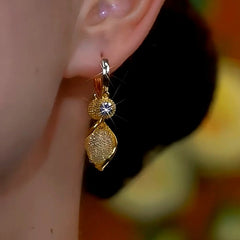 Model showcasing the dangle and style of the 14K Gold-plated Luxury Zircon Mesh Drop Earrings
