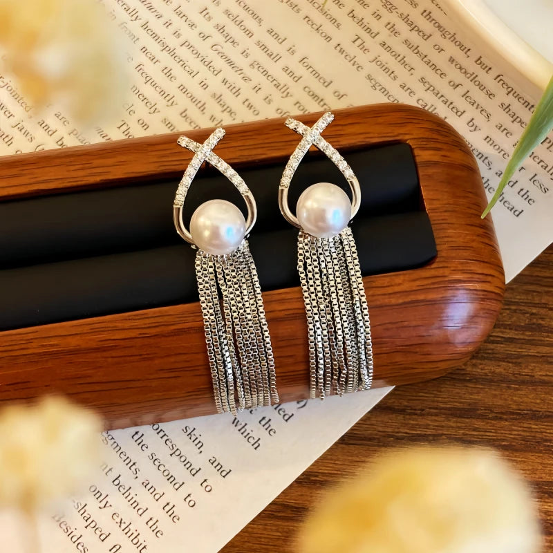 Angled view of the 14K Gold-plated Pearl Tassel Earrings