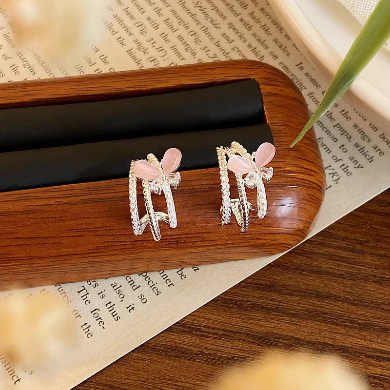 Close-up detail of the sparkling zircons and plating on the Pink Butterfly Studs
