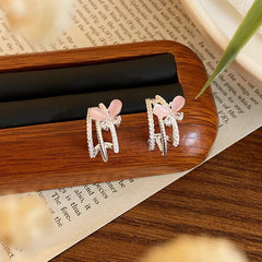Close-up detail of the sparkling zircons and plating on the Pink Butterfly Studs