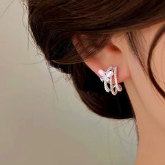 Model showcasing the dangle and style of the 14K Gold-plated Pink Butterfly Studs