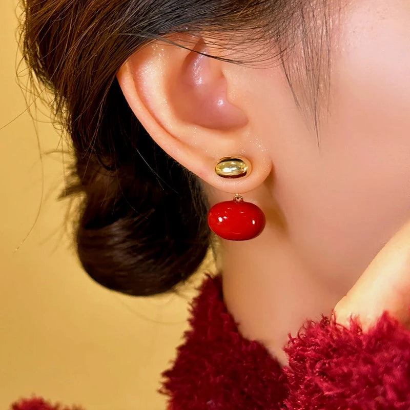 Close-up detail of the sparkling zircons and plating on the Red Enamel Earrings