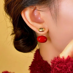 Close-up detail of the sparkling zircons and plating on the Red Enamel Earrings