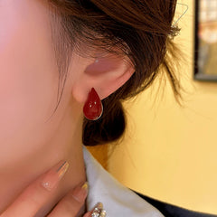 Angled view of the 14K Gold-plated Red Water Drop Earrings