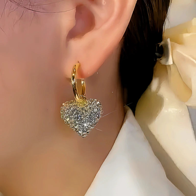 Close-up detail of the sparkling zircons and plating on the Rhinestone Heart Earrings