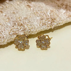 Close-up detail of the sparkling zircons and plating on the Rotating Clover Earrings