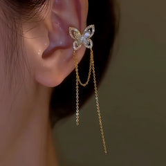 Model showcasing the dangle and style of the 14K Gold-plated Shell Butterfly Tassel Ear Cuffs (1 Pair)