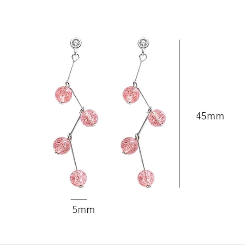 Angled view of the 14K Gold-plated Strawberry Crystal Earrings