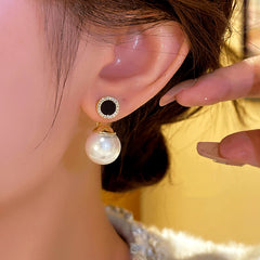 Close-up detail of the sparkling zircons and plating on the Bead Jacket Earrings