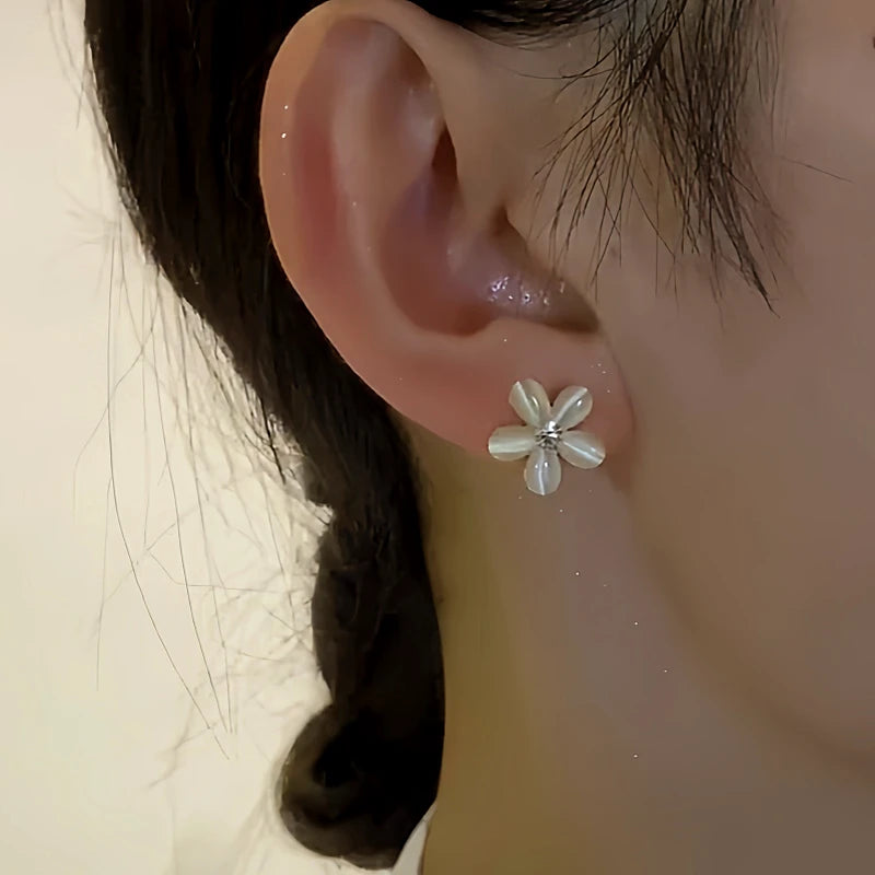 Close-up detail of the sparkling zircons and plating on the Flower Jacket Earrings