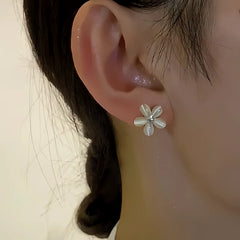 Close-up detail of the sparkling zircons and plating on the Flower Jacket Earrings
