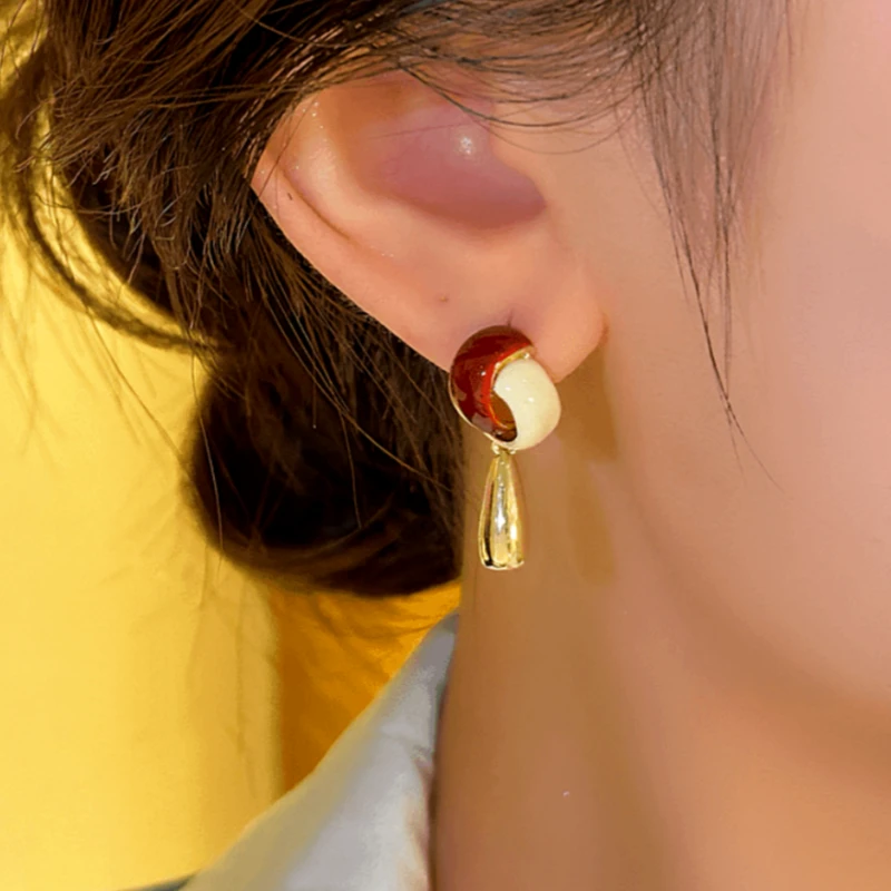 Close-up detail of the sparkling zircons and plating on the Water Drop Tassel Earrings