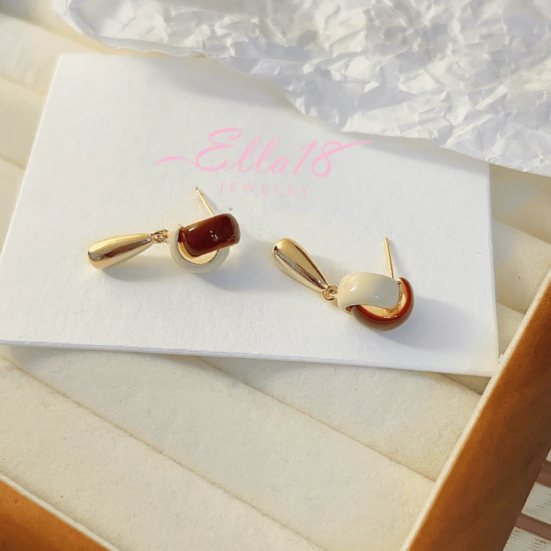 Angled view of the 14K Gold-plated Water Drop Tassel Earrings