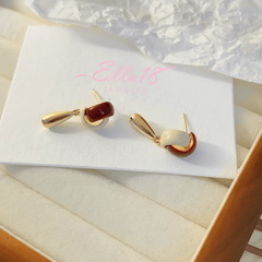 Angled view of the 14K Gold-plated Water Drop Tassel Earrings