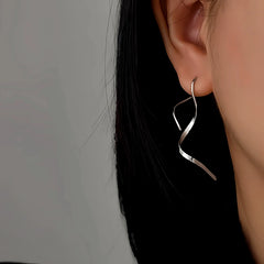 Close-up detail of the sparkling zircons and plating on the Wavy Threader Earrings