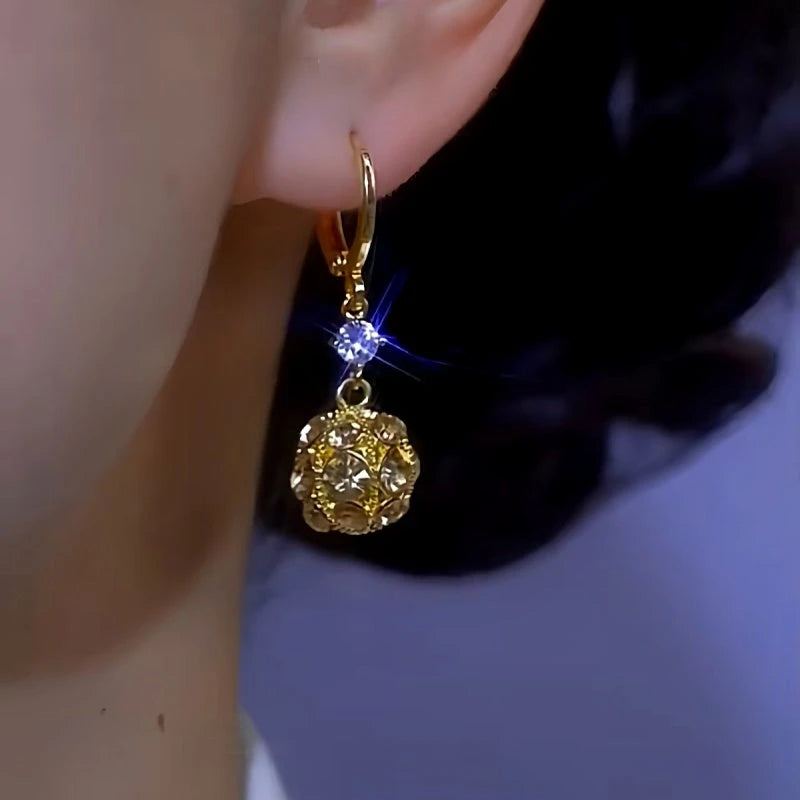 Close-up detail of the sparkling zircons and plating on the Zircon Ball Earrings