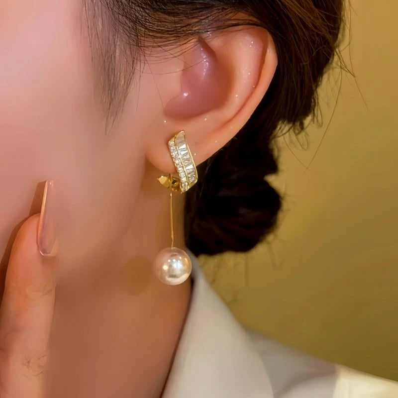 Close-up detail of the sparkling zircons and plating on the Bead Tassel Earrings